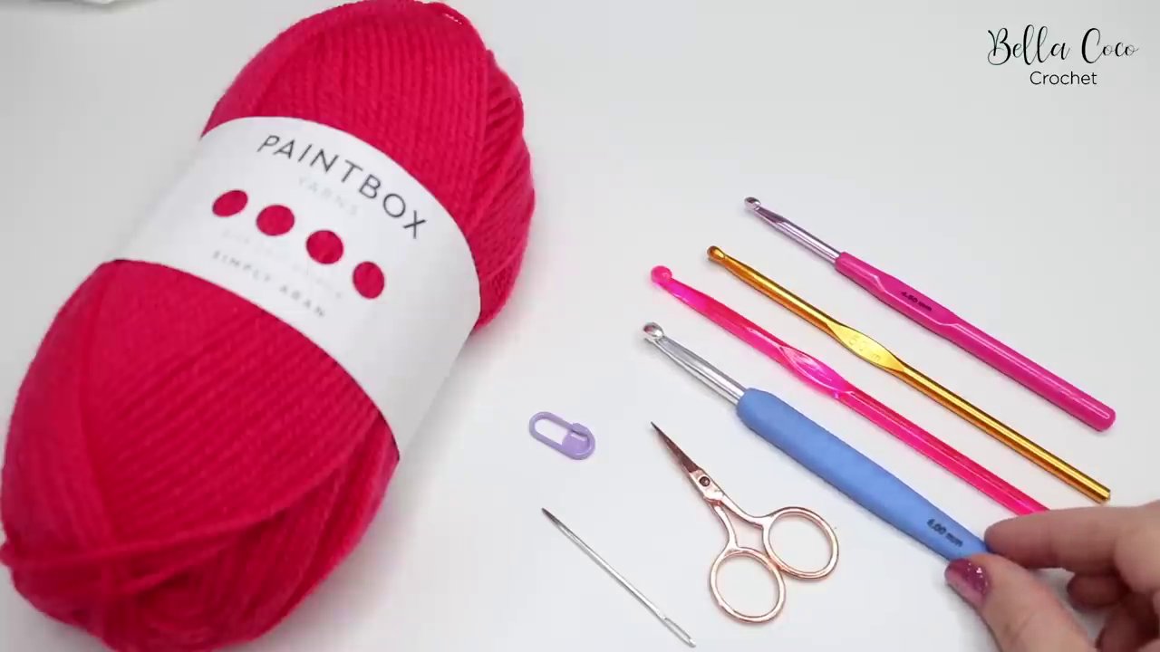 A selection of different crochet hooks, including aluminium with a soft grip, acrylic, and full aluminium models.