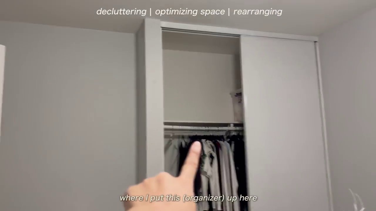 A close-up of smaller yarn balls being neatly organized into a storage container, showcasing a variety of colors.