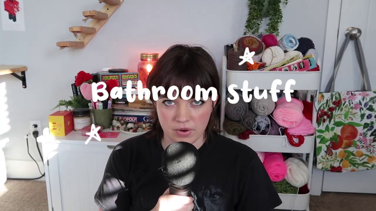 A collection of colorful animal-shaped crochet scrubbies hanging from a hook.