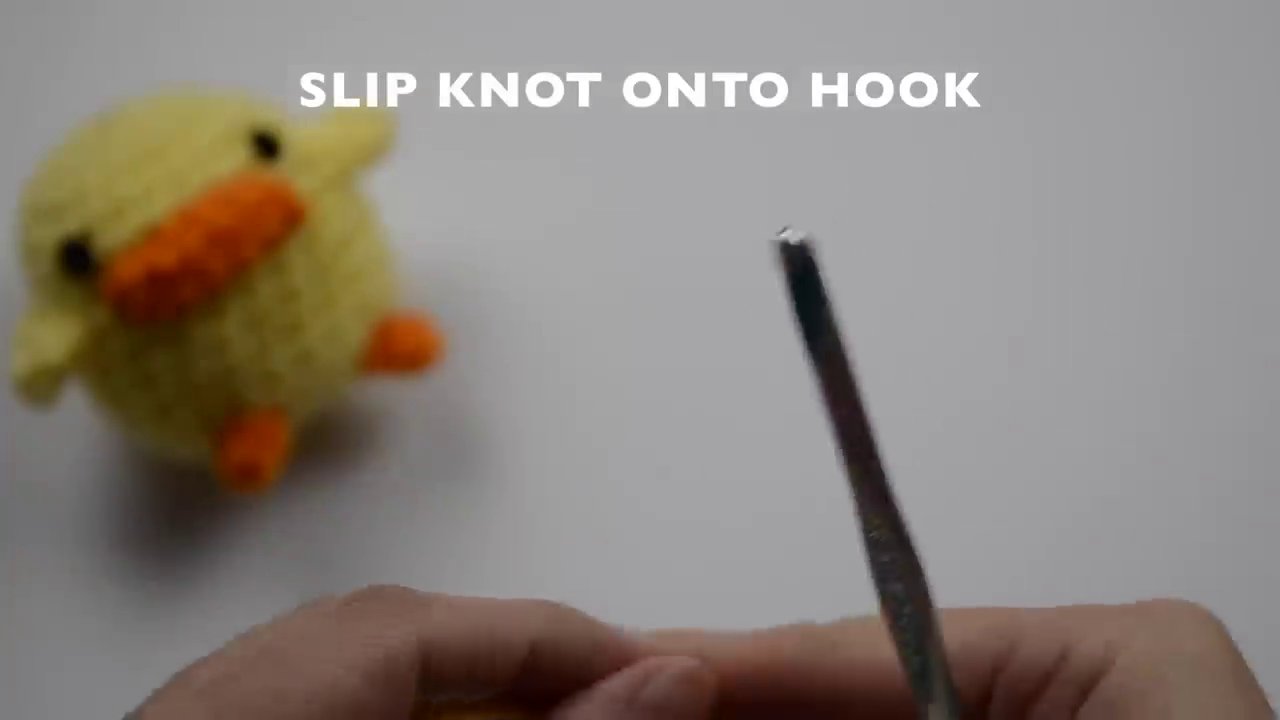 The final step of creating an adjustable slip knot directly onto the crochet hook.