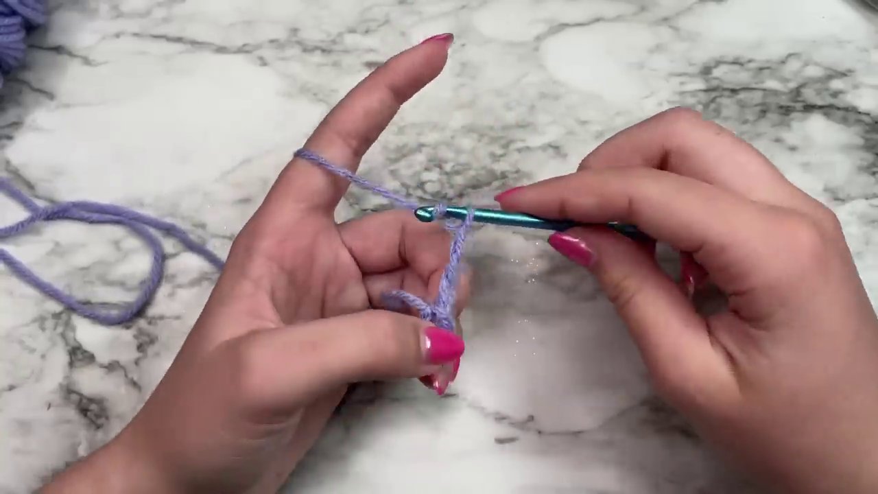 The completed first round of the granny square, showing the four distinct chain-3 corner spaces.