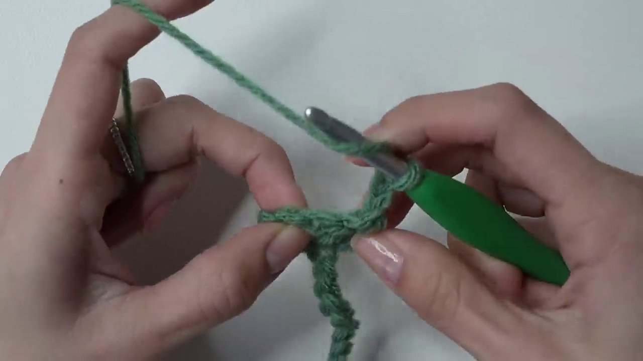 Showing the mesh pattern developing, with clear chain-one spaces between the double crochet posts.