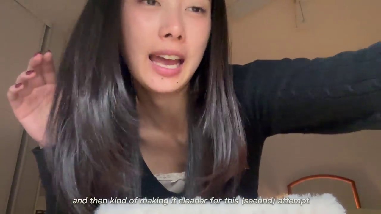 The creator filming a tutorial, indicating the ongoing process of sharing her methods with the audience.