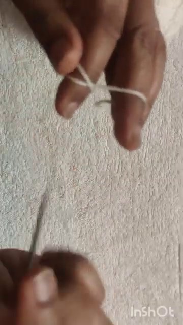 A completed magic ring with 12 double crochets, ready to be pulled tight.