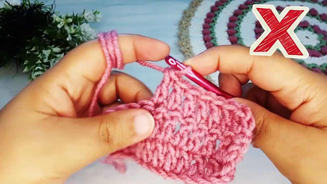 Side view of a crochet hook showing the correct yarn over position.