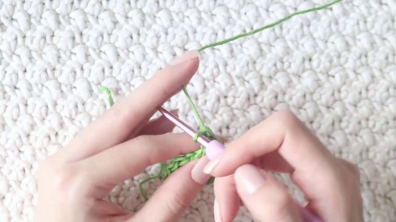 The small leaf pinned flat, showing the pointed tip and even stitch progression.