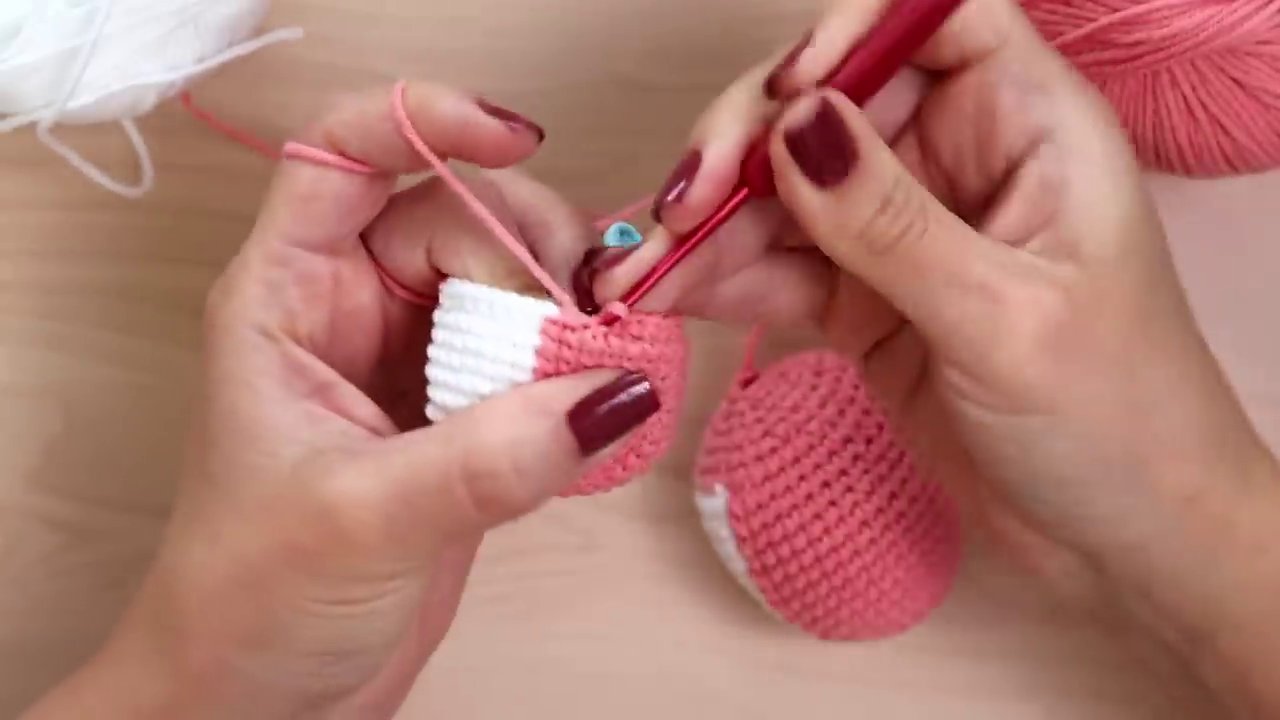 Hand demonstrating pulling the hook upward instead of to the side while making a single crochet.