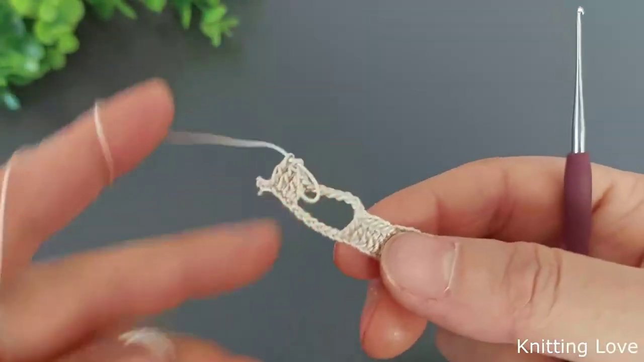 A wider view of the finished stitches, showing the alternating open and closed sections of the pattern.