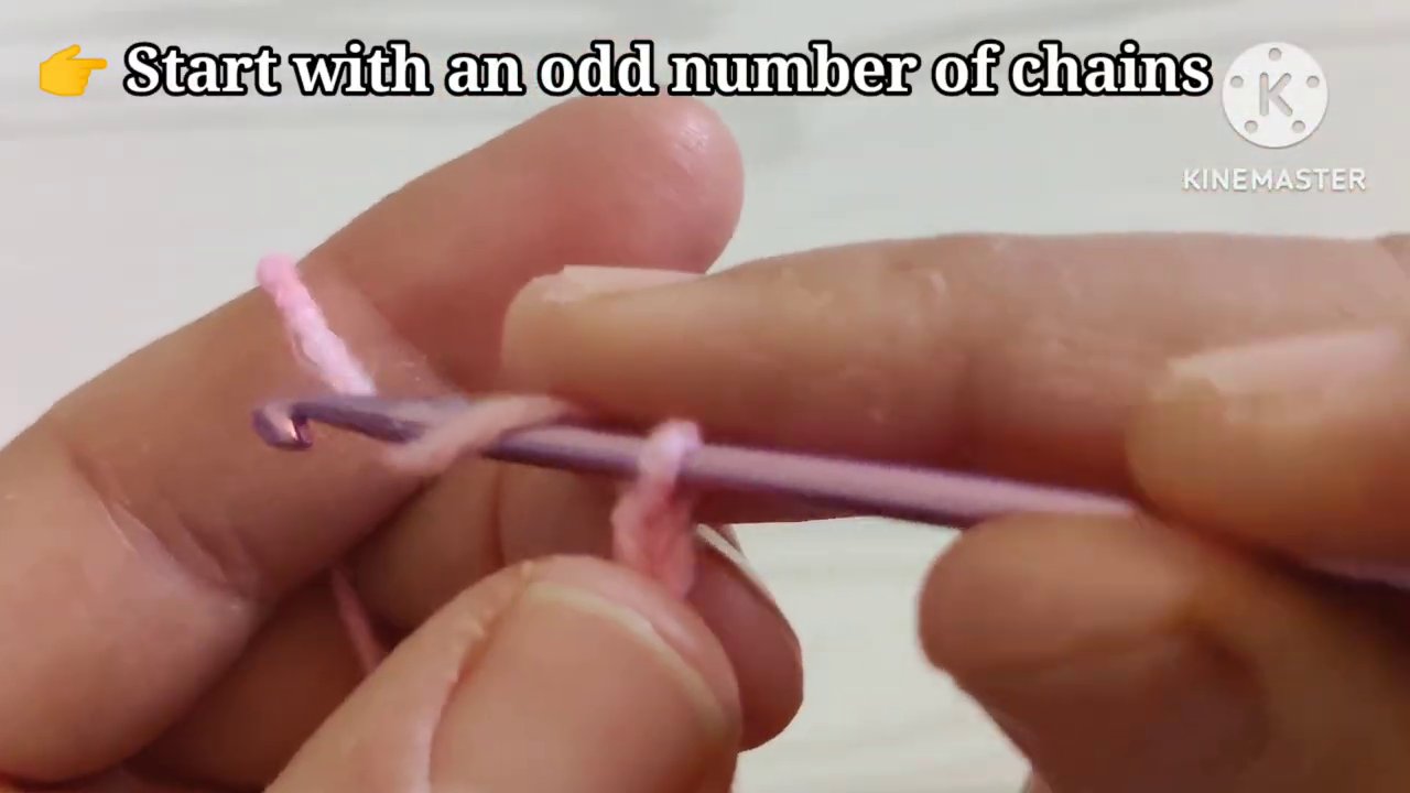 Hook inserting around the post of the stitch below, creating the raised front post double crochet.