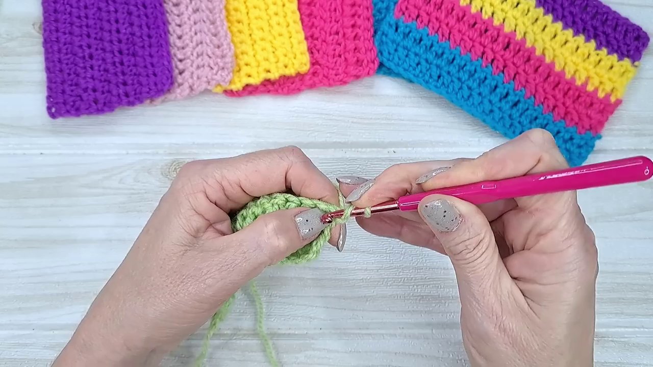 A demonstration of the double treble crochet edge technique, showing the three-step closing process.