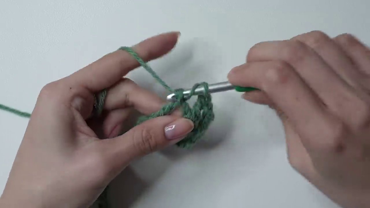 A close-up of the mesh stitch, showing the V-shaped openings and even tension.