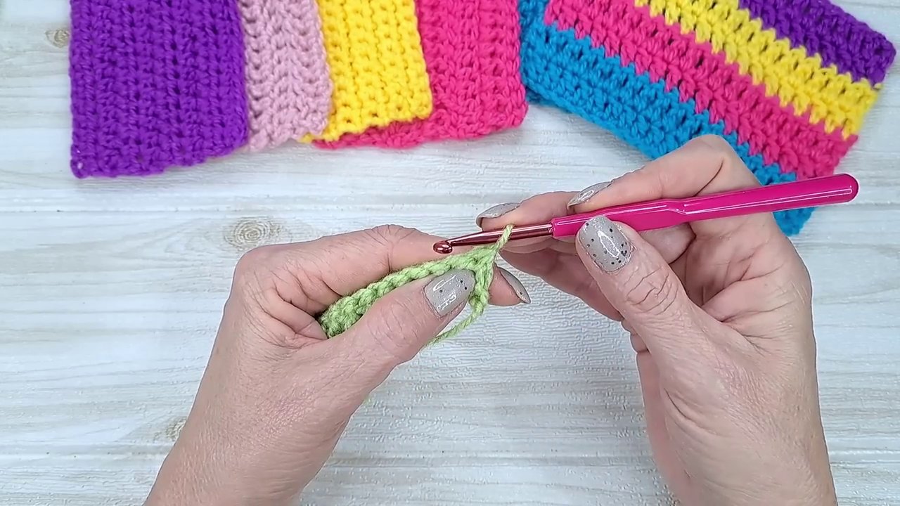 A finished scarf edge shown against a neutral background, highlighting the clean, professional finish.