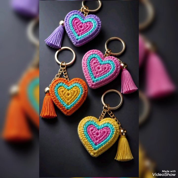 Close-up of a hand attaching a gold earring hook to a crochet circle using a jump ring.