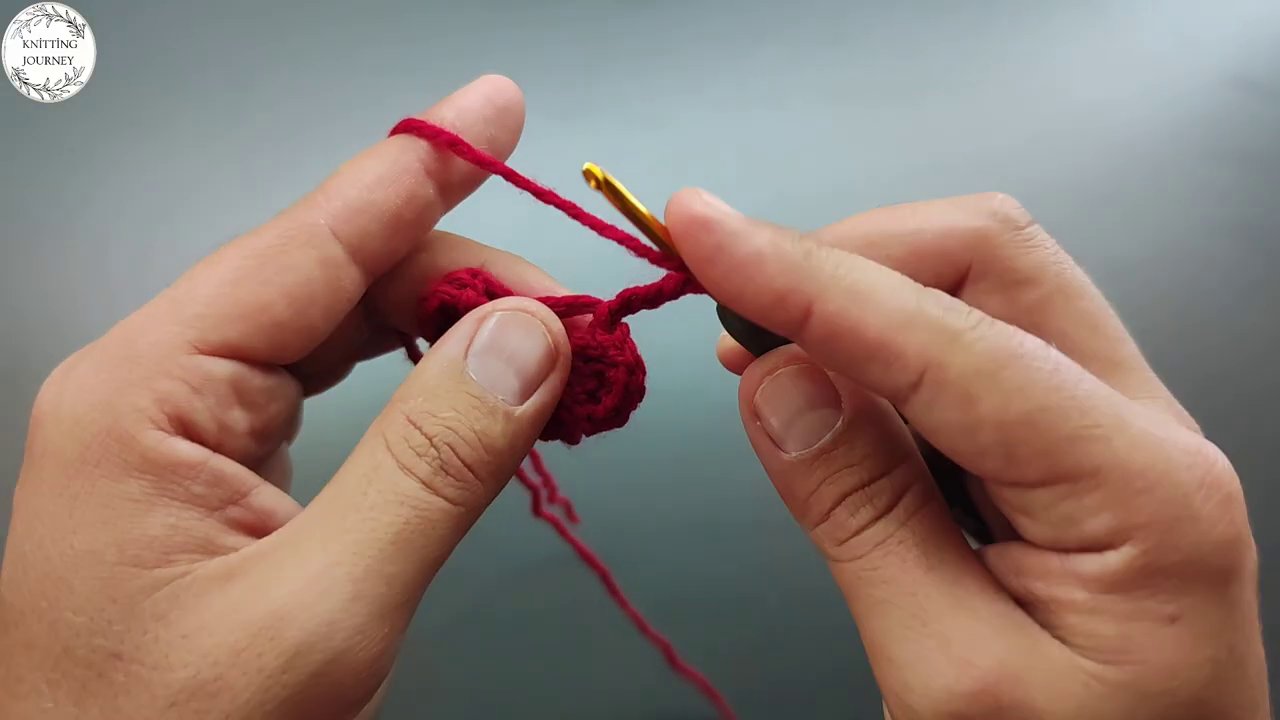 Multiple pink loops and stitches showing the developing pattern and texture across the piece.