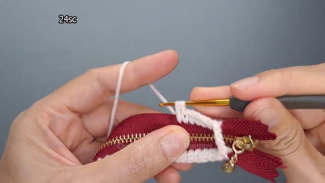 The completed mini coin purse sitting open, showing the interior space.